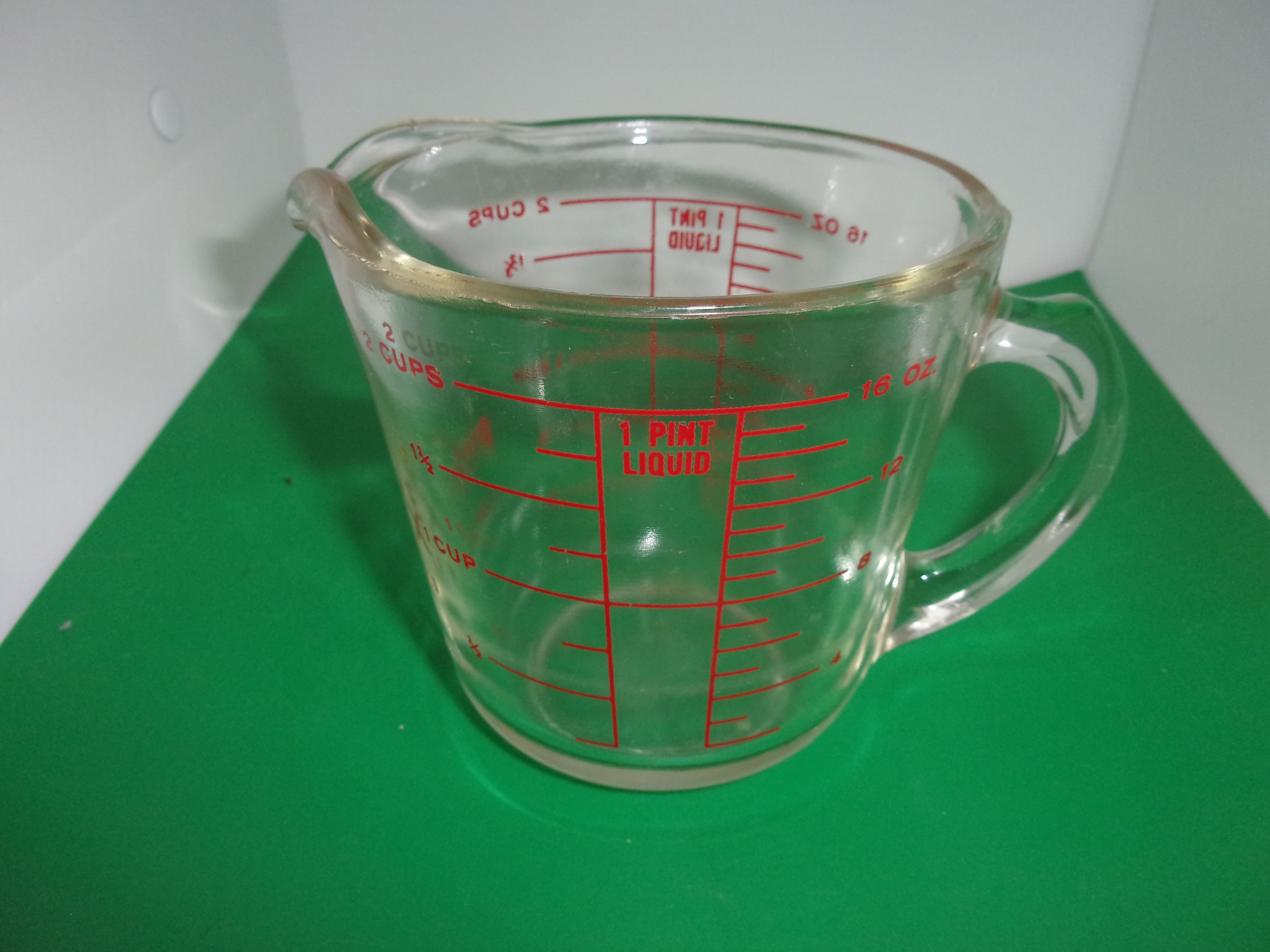 Newer Pyrex measuring cup, Made in USA: 396 ppm Cadmium on red exterior  writing